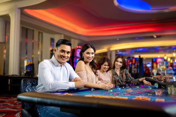SOUL777 Casino — Step inside our high-end casino experience A glamorous woman holding casino chips in a neon-lit environment, representing the premium online casino atmosphere of SOUL777.